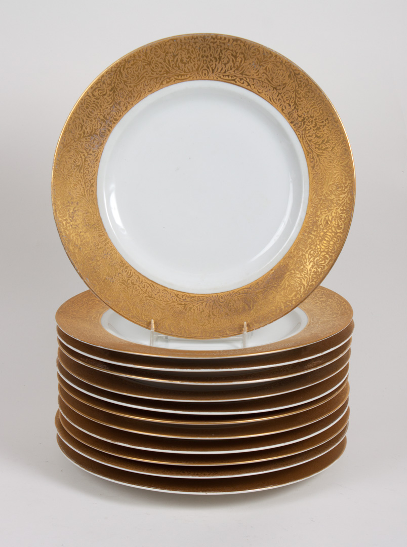 Appraisal: Hutschenreuther dinner plates mid- th century with raised foliate gilt-banded