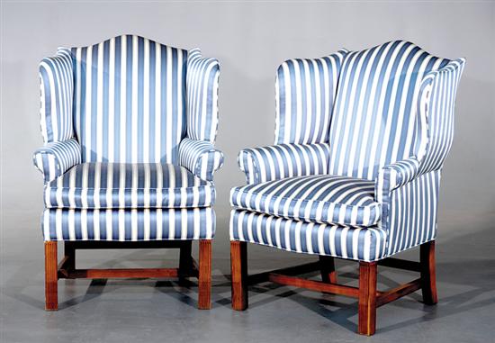 Appraisal: Pair Georgian style wingback chairs th century domed crest flanked