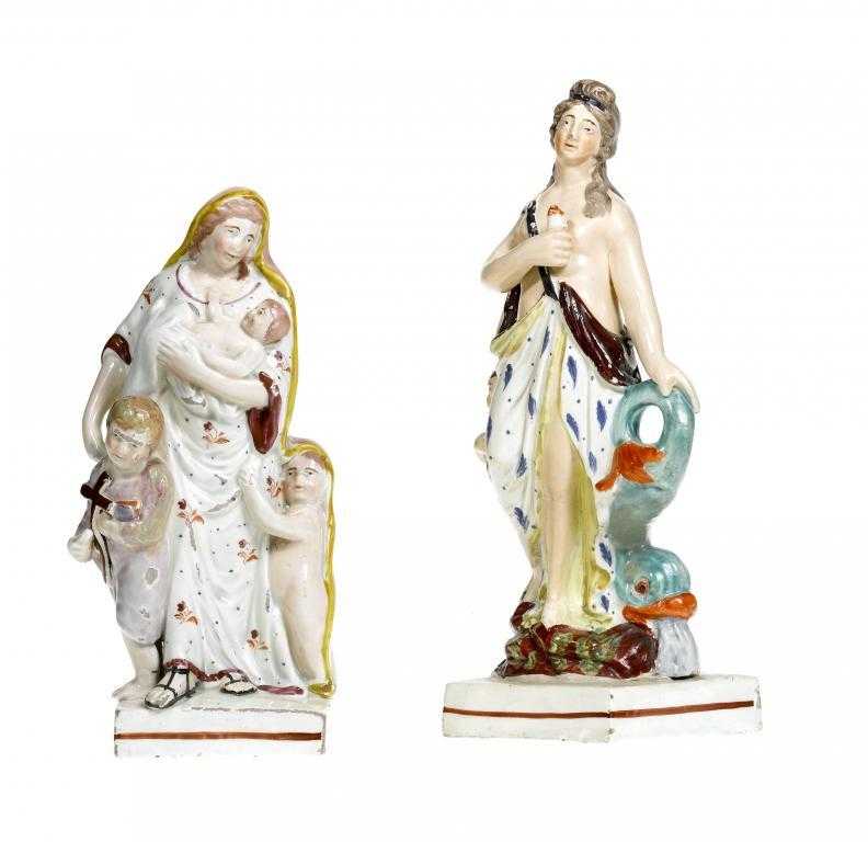 Appraisal: TWO STAFFORDSHIRE PEARLWARE ALLEGORICAL FIGURES OF CHARITY AND AN ELEMENT