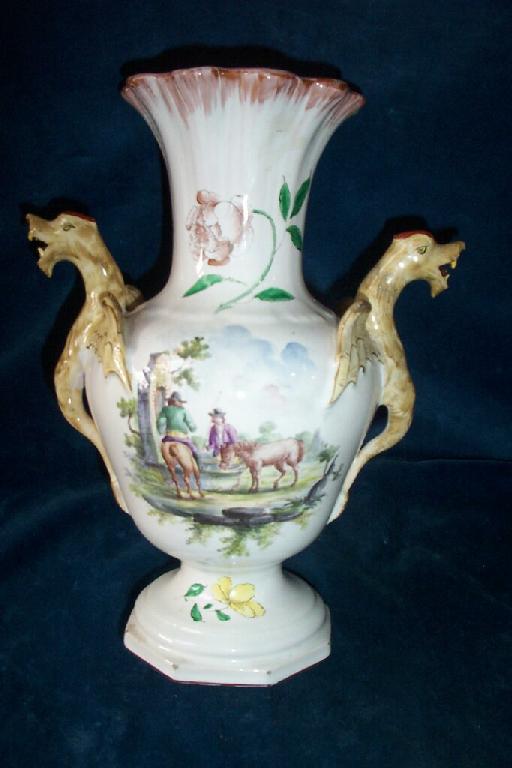 Appraisal: A continental tin glazed earthenware vase with painted panel of