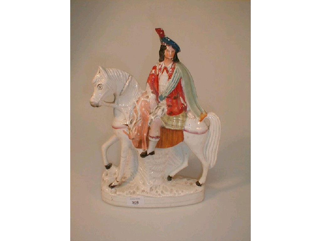 Appraisal: A thC Staffordshire pottery equestrian figure of a Scottish Highlander