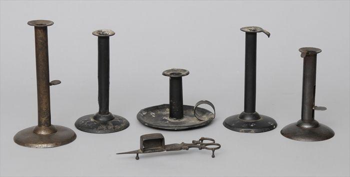 Appraisal: FOUR TOLEWARE HOG SCRAPER CANDLESTICKS AND A CHAMBERSTICK Each with