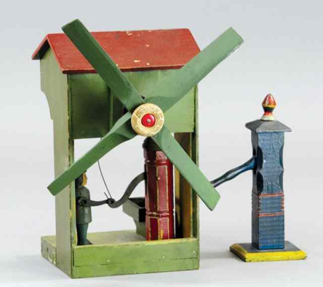 Appraisal: WHIRLIGIG AND PUMP Early 's wood whirligig depicts man with