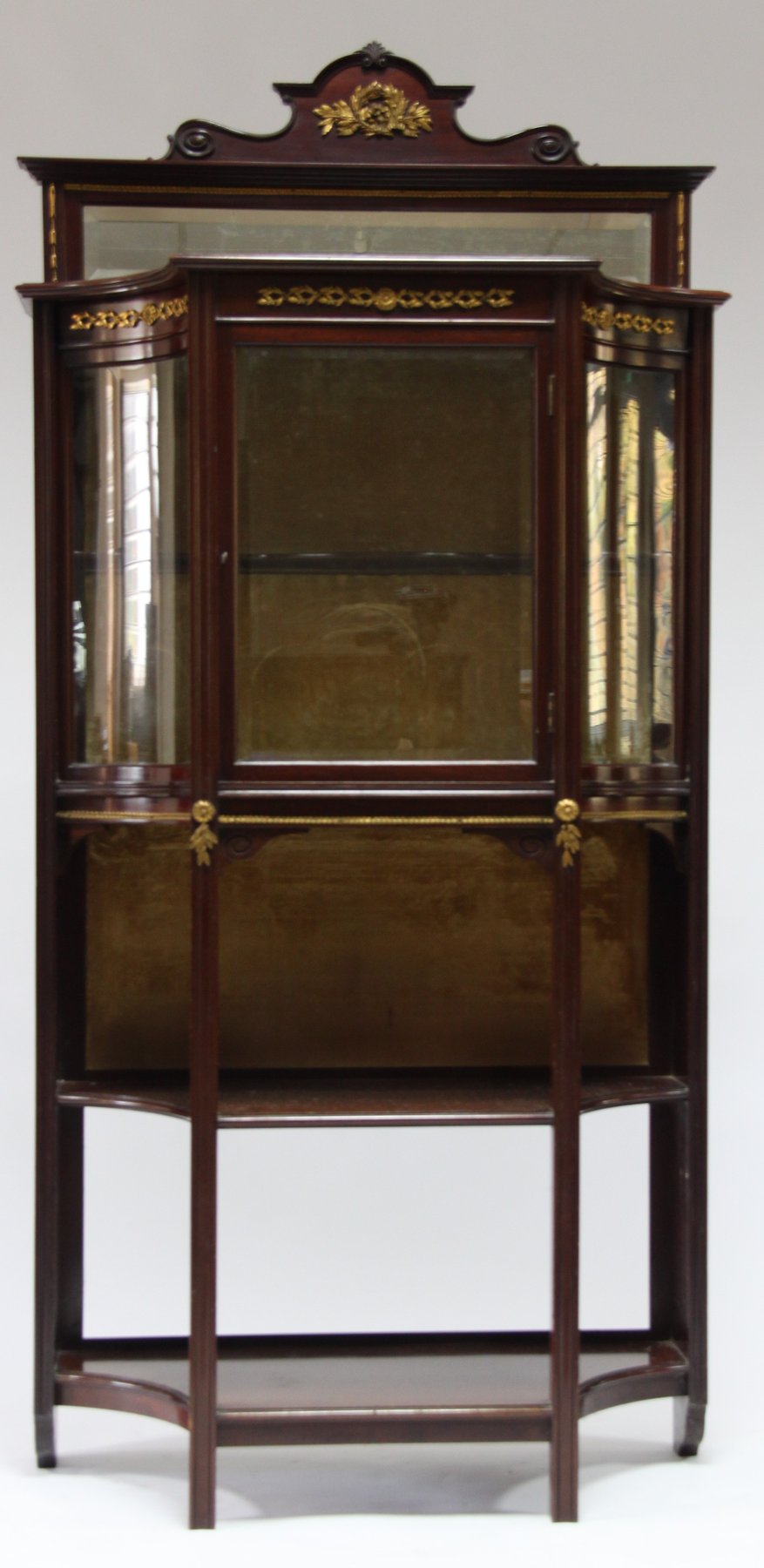 Appraisal: An Edwardian mahogany and gilt metal mounted display cabinet the