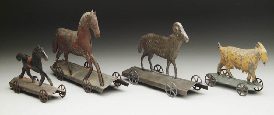 Appraisal: LOT OF FOUR EARLY AMERICAN PLATFORM TOYS Ram on platform