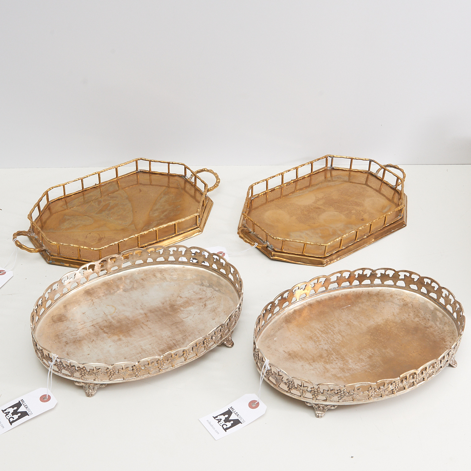 Appraisal: PAIRS VINTAGE DESIGNER GALLERY TRAYS th c incl a grape