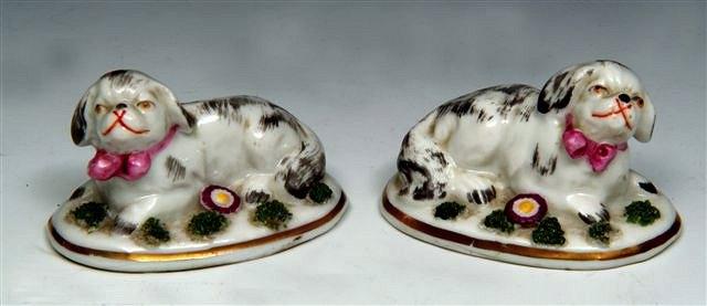 Appraisal: A PAIR OF CONTINENTAL PORCELAIN MINIATURE MODELS OF SPANIELS each