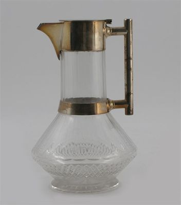 Appraisal: An electroplated metal and glass decanter in the manner of