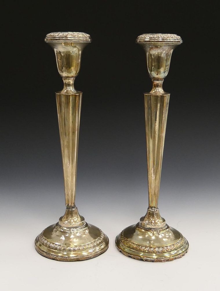 Appraisal: PAIR STERLING WEIGHTED CANDLESTICKS PAIR STERLING WEIGHTED CANDLESTICKS measures height