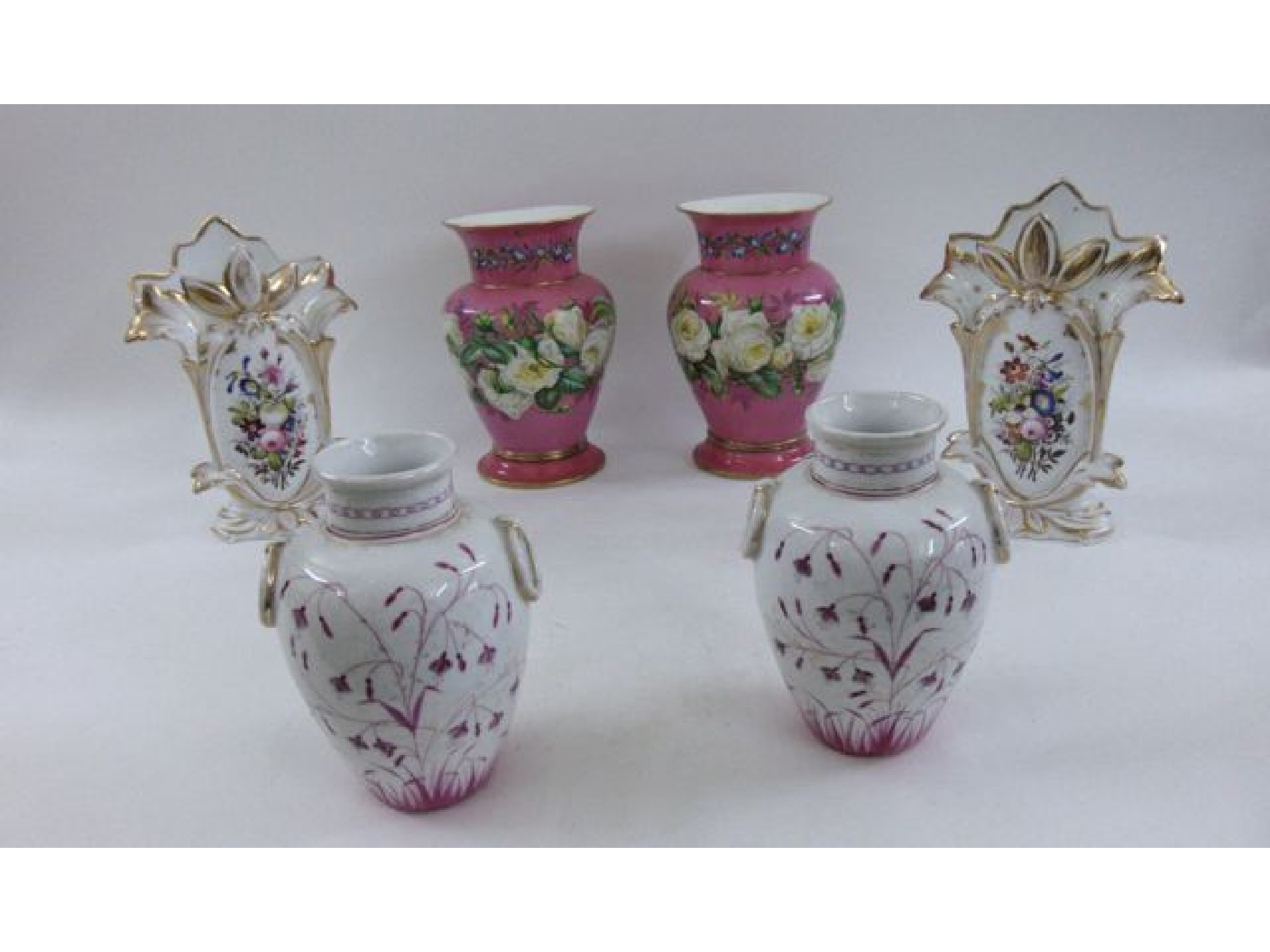 Appraisal: A pair of th century continental oviform vases the pink