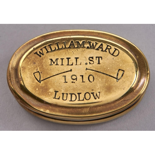 Appraisal: An oval brass snuff box dated stamped with clasped hands