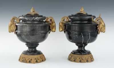 Appraisal: A Pair of Black Marble Urns with Ormolu Mounts and