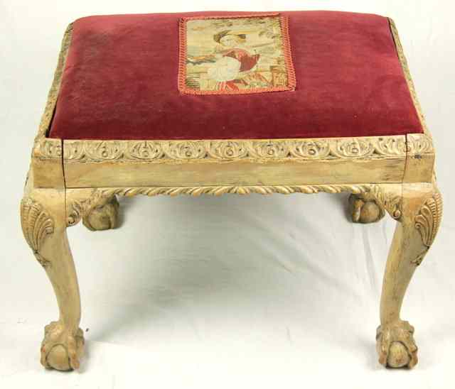 Appraisal: A walnut stool of Chippendale design with carved border and