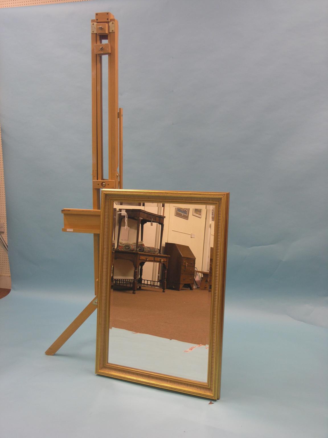 Appraisal: A moulded gilt mirror rectangular with bevelled plate ft in