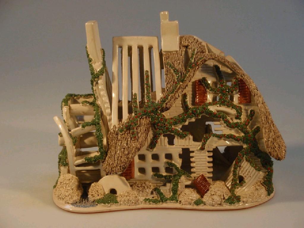 Appraisal: A Canziana pottery model of the ruins of a thatched