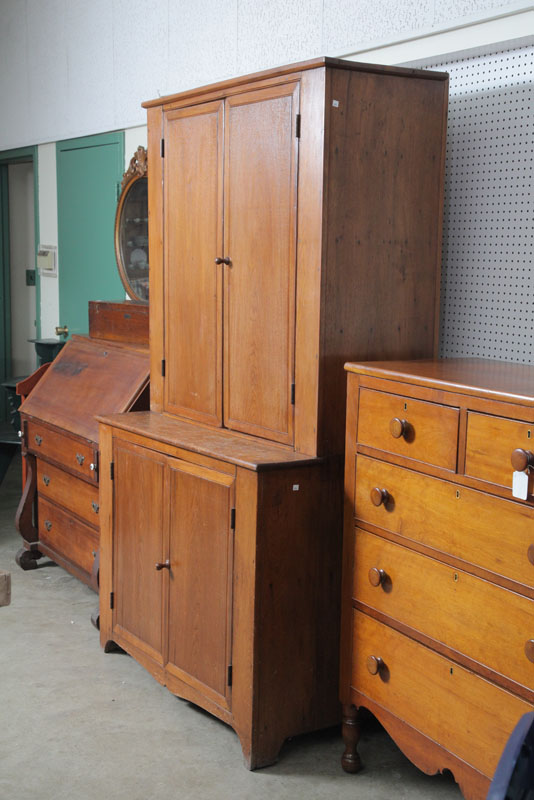 Appraisal: STEPBACK CUPBOARD Walnut with four blind and incised doors and