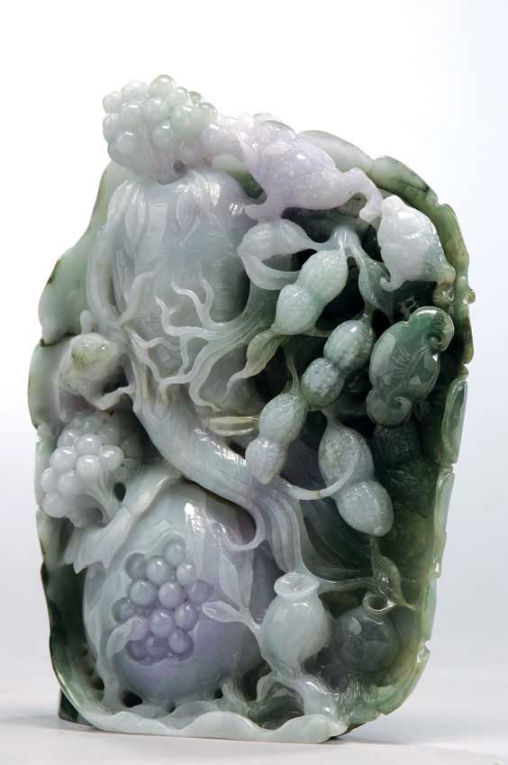 Appraisal: JADEITE FRUIT GROUP CARVING Elaborately carved Chinese jadeite model of