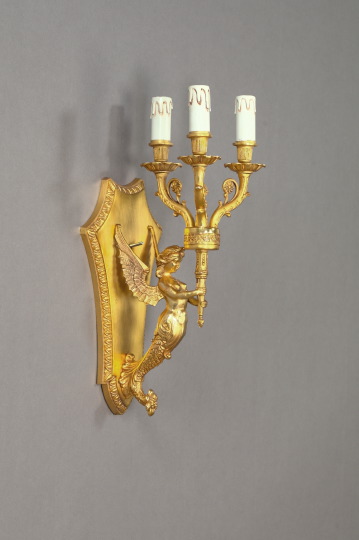 Appraisal: French Richly Gilded Brass Three-Light Nike Applique first quarter th