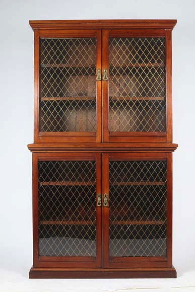 Appraisal: AN ANTIQUE MAHOGANY LIBRARY CABINET the glazed doors above and