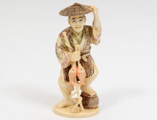 Appraisal: CARVED IVORY FIGURE OF A FISHERMAN Japanese Signed Standing with