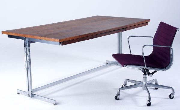 Appraisal: HUGH ACTON CHARLES EAMES Three-drawer walnut desk on polished steel