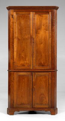 Appraisal: North Carolina walnut corner cupboard single-case construction figured walnut paneled