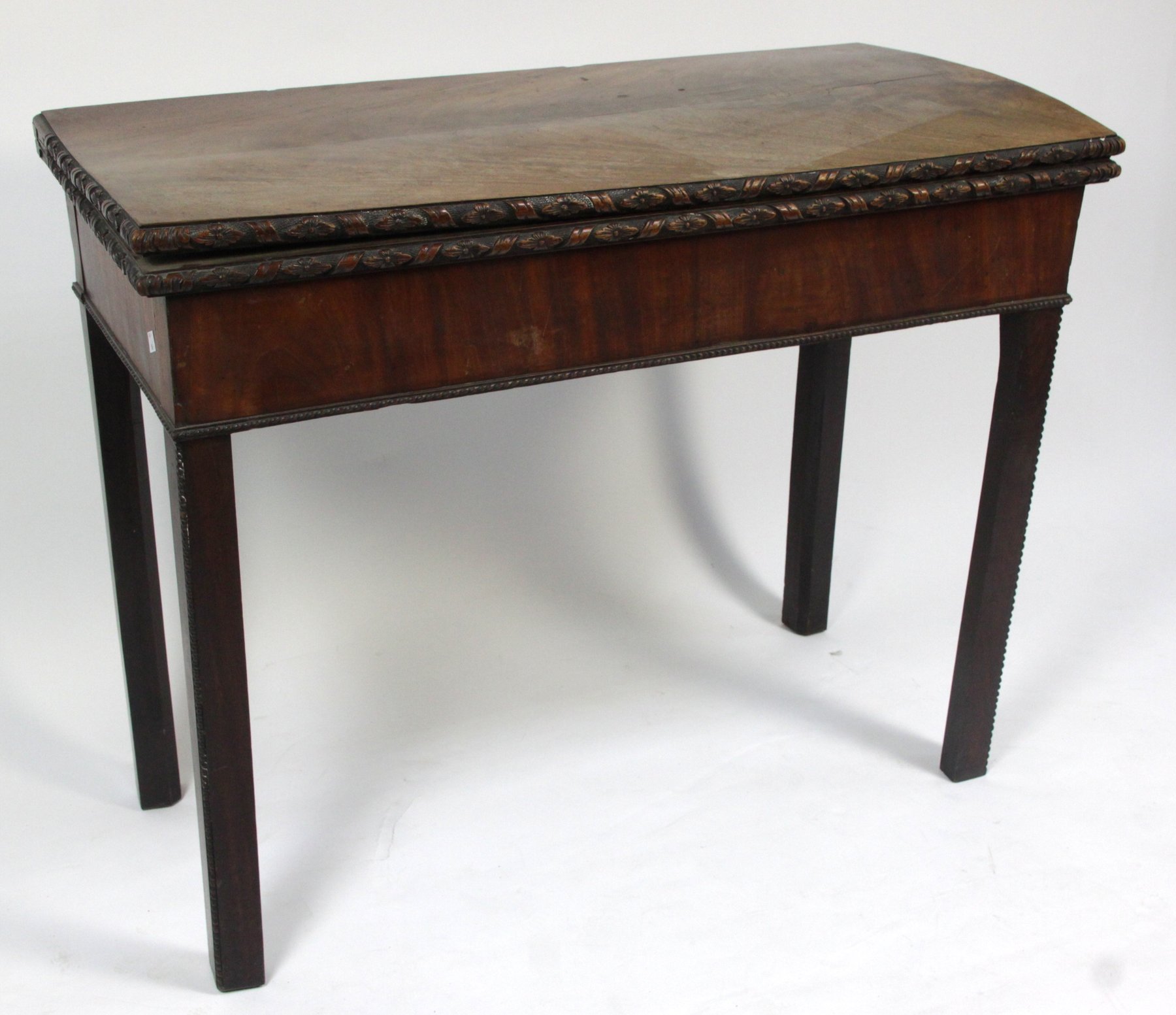 Appraisal: A George II mahogany card table circa the rectangular fold-over