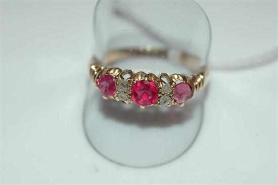 Appraisal: A RED STONE AND DIAMOND HALF HOOP RING IN CT