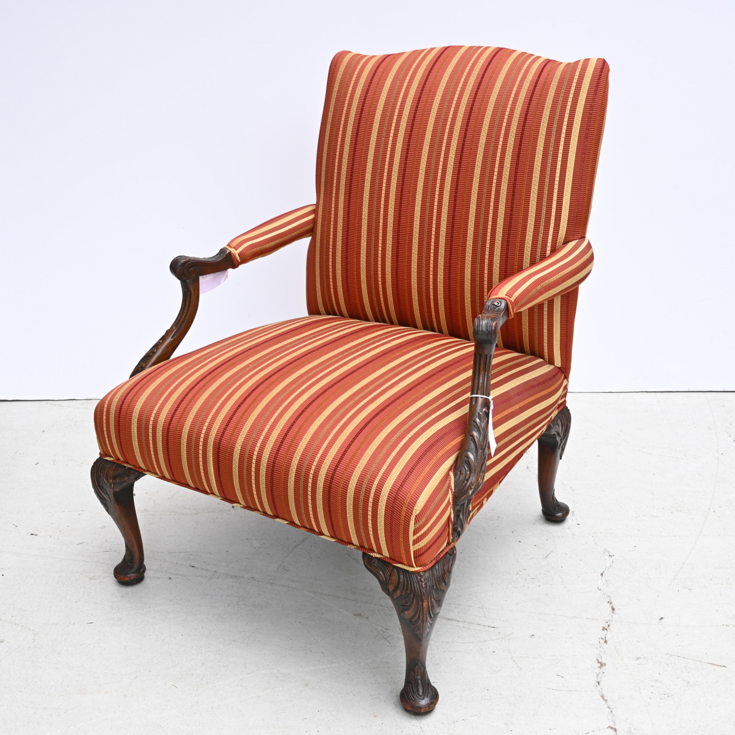 Appraisal: GEORGIAN STYLE UPHOLSTERED LIBRARY CHAIR th c with deep red