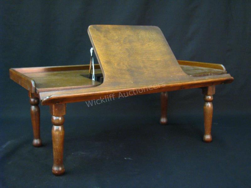 Appraisal: An antique breakfast in bed tray with hinged convertible top