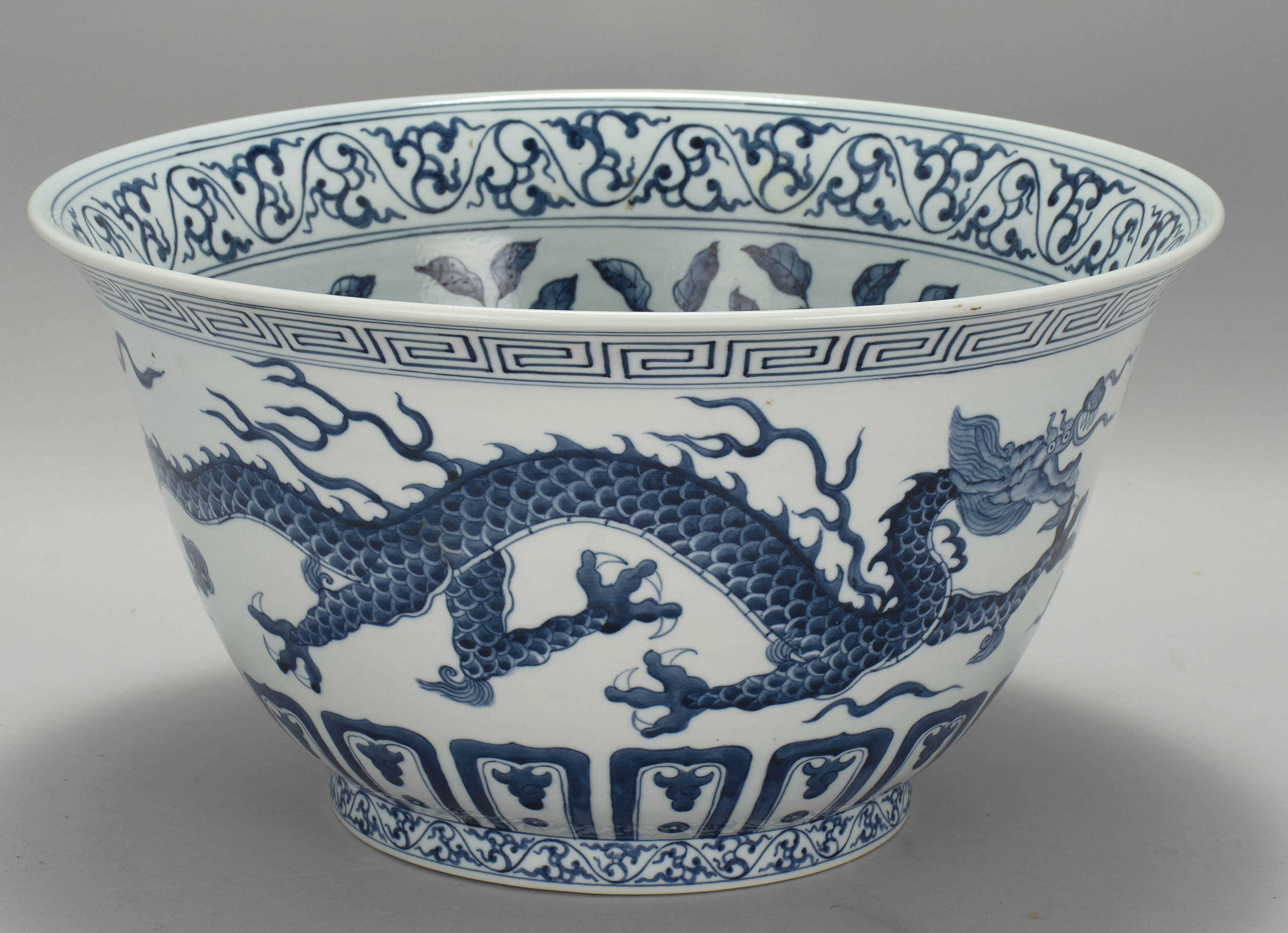 Appraisal: BLUE AND WHITE PORCELAIN BOWL th CenturyWith dragon design on