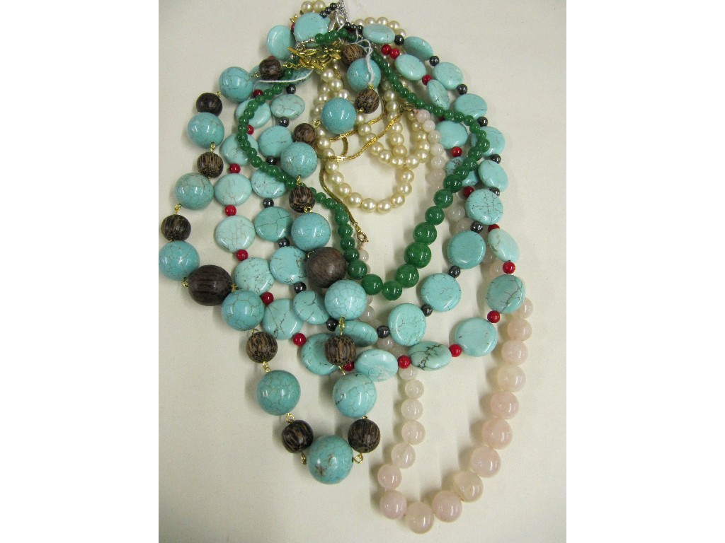 Appraisal: Three strings of turquoise beads string of rose quartz beads