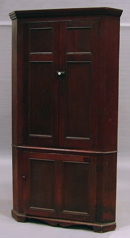 Appraisal: Molded cornice one-piece case twin recessed paneled doors shelved interior