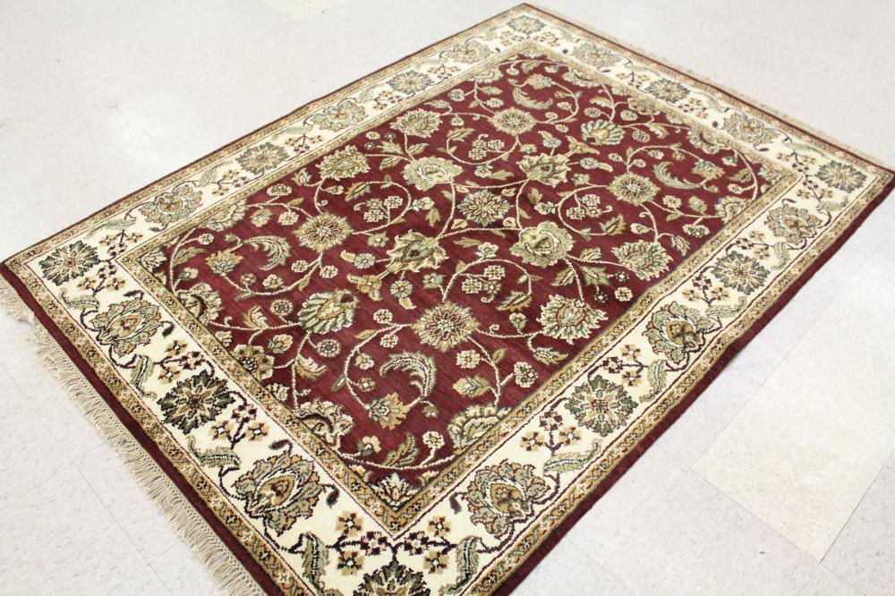 Appraisal: HAND KNOTTED ORIENTAL AREA RUG Indo-Persian floral vine motif on