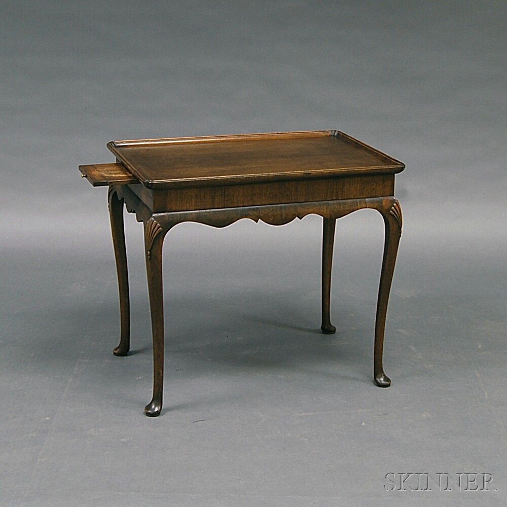 Appraisal: Queen Anne-style Walnut Tea Table the rectangular dished top over