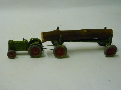 Appraisal: Marlow Products Tractor with log trailer green with red wheels