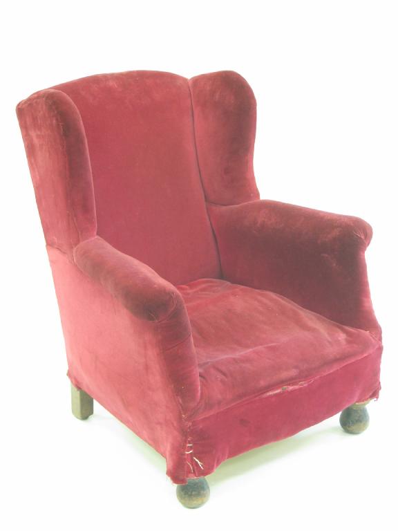 Appraisal: A Victorian Child's wing Armchair with red upholstery on turned