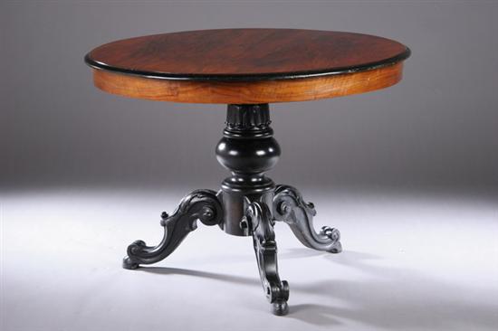 Appraisal: ROCOCO REVIVAL EBONIZED AND WALNUT CENTER TABLE th century Robustly