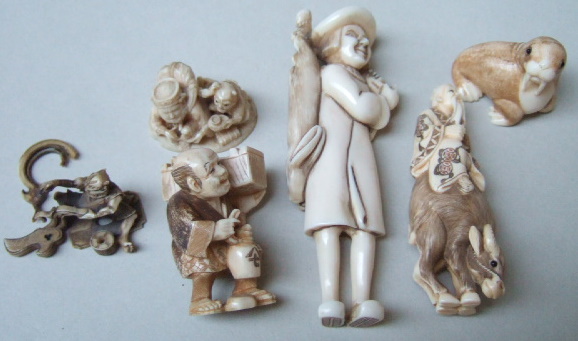 Appraisal: A group of six ivory netsuke comprising a group of