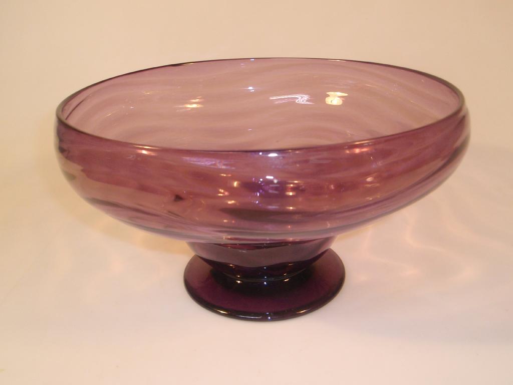 Appraisal: An amethyst glass pedestal bowl of inverted baluster form with