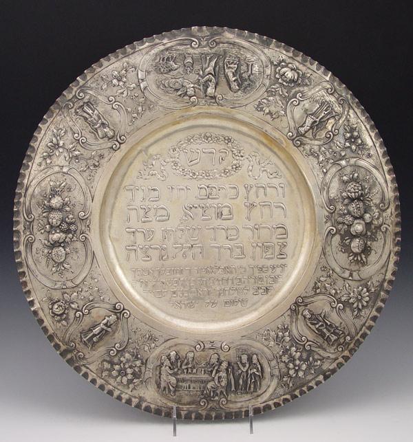 Appraisal: SILVER JUDAIC PASSOVER PLATE Embossed vignettes '' dia Tests as