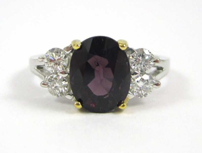 Appraisal: SPINEL DIAMOND AND FOURTEEN KARAT GOLD RING with two round