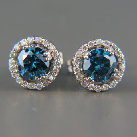 Appraisal: Diamond Earrings blue diamonds surrounded by white diamonds totaling carats