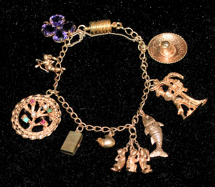 Appraisal: - Unmarked tested k gold charm bracelet with a gold-filled