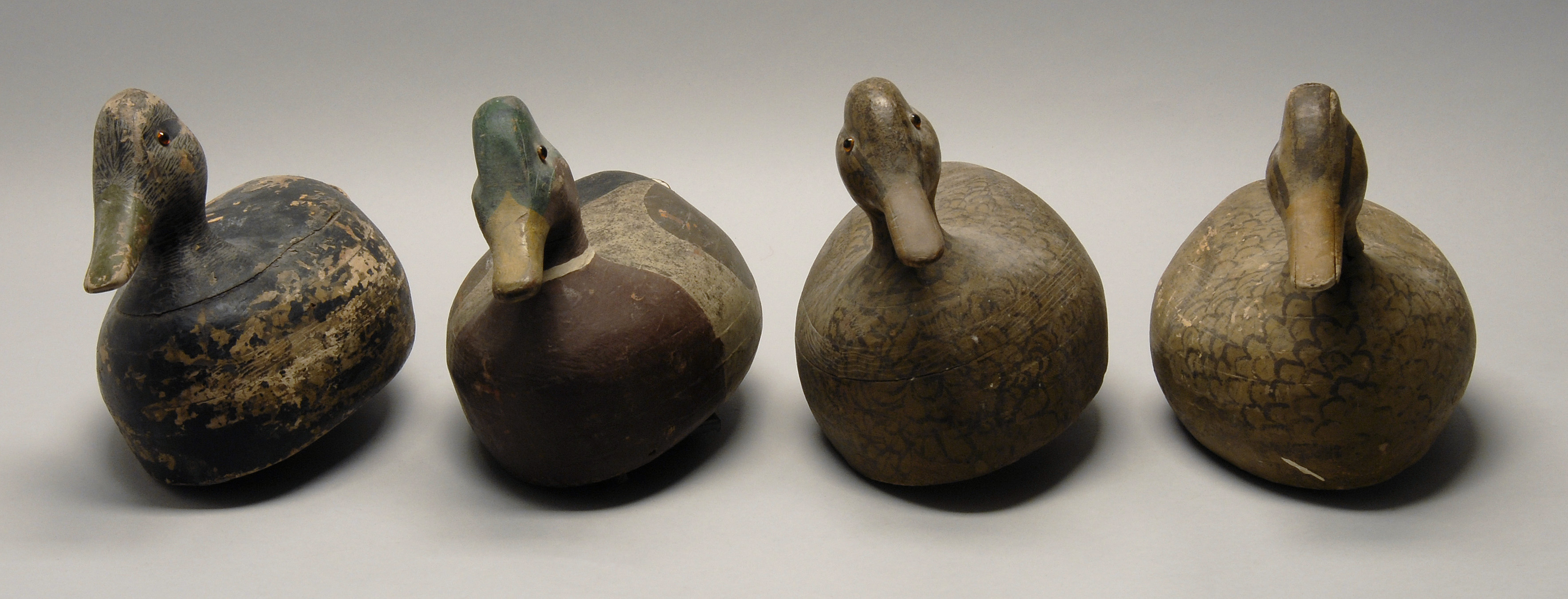 Appraisal: FOUR DECOYS Circa Three mallards and a black duck from