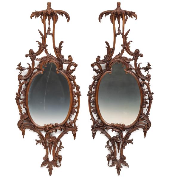 Appraisal: A FINE PAIR TH C FRENCH CARVED WALNUT ROCOCO MIRRORSThe