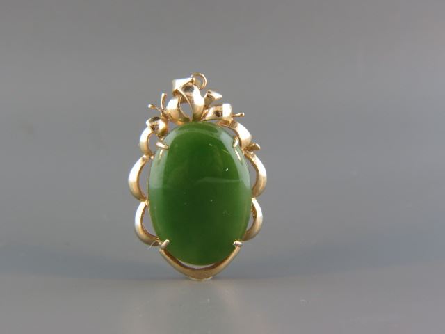 Appraisal: Jade Pendant large spinach green oval cabachon in k yellow