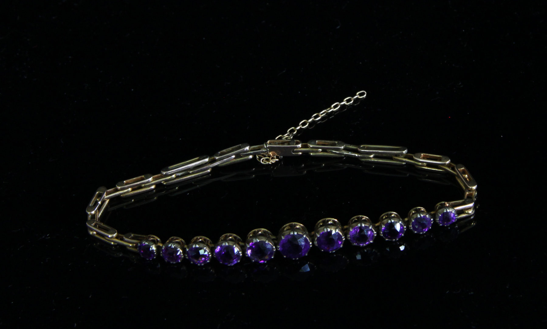 Appraisal: An amethyst bracelet the eleven graduated stones claw set to