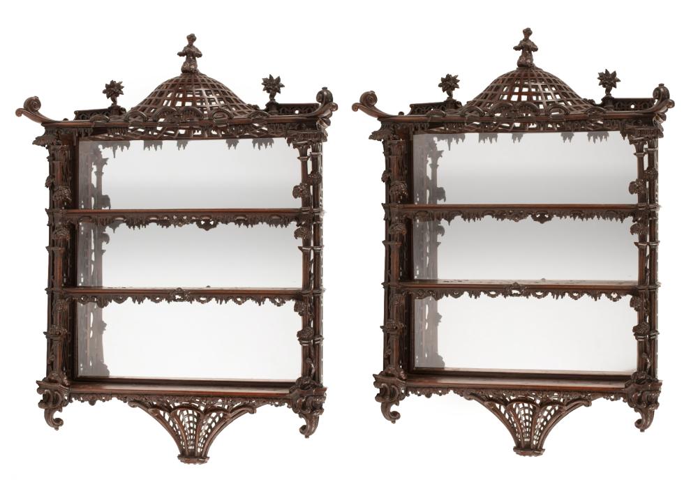 Appraisal: Pair of Chinese Chippendale-Style Carved Mahogany Wall Shelves figural finial