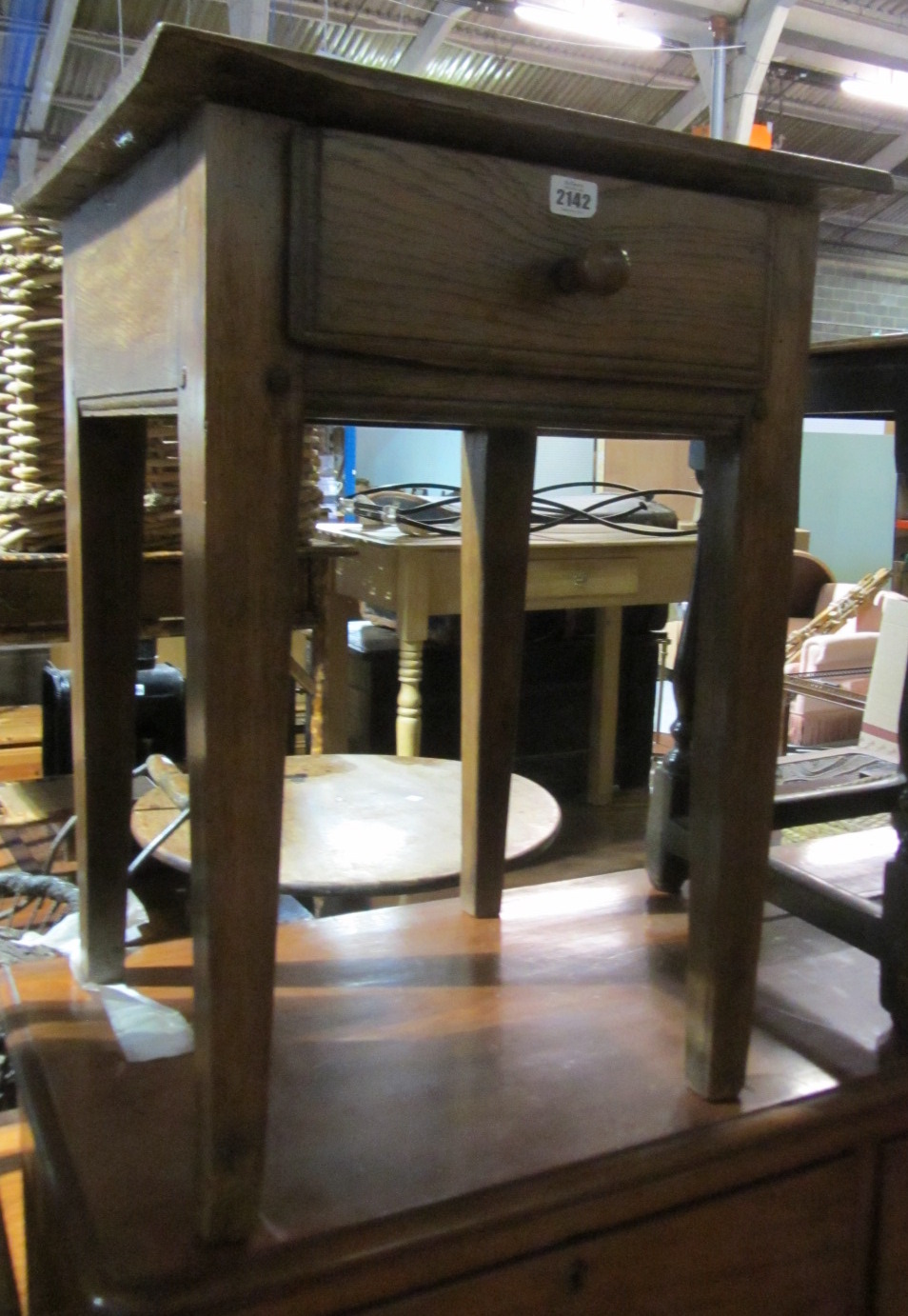 Appraisal: An early th century oak single drawer side table on